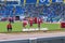 Referee preparing the triple jump pit 