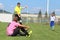 The referee whistled a foul on a young soccer player