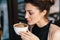 Refined Woman Enjoying Cappuccino or Latte on a vibrant, colorfu