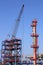 Refinery construction site with crane