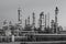 refinery with countless pipes, tanks, and valves to distill and process oil