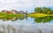 Reflected houses in the Lake Lod near the village of Chamois in Val D`Aosta, Italy.