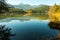 Reflected mountains viewed from the shore of Gun Lake, British Columbia, Canada