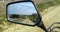 Reflected road in rearview mirror