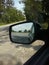 the reflected road in the rearview mirror