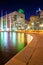 The reflecting pool at City Hall and buildings at night, in Dallas, Texas.