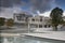 Reflecting pools at the Scottish Parliament in Edinburgh with storm clouds