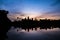 Reflection of an Angkor Wat in silhouette look in Siem Reap, Cam