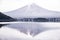 The reflection of beautiful Fuji mountain with bridge in lake  in the summer, the famous landmark and attraction place of tourists