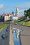 Reflection of the bell tower of the Spaso-Preobrazhensky Cathedral in a puddle on the Volga embankment. Rybinsk, Yaroslavl region