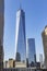 Reflection of the blue sky in the glass of the imposing One World Trade Center building in New York, USA