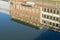 Reflection of buildings on the waters Arno river in Florence