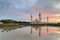 Reflection of Bukit Jelutong Mosque with stunning blue and red clouds and ray of lights