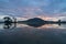 Reflection of Bukit Mertajam hill with burning cloud.