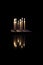 Reflection of candle on granite floor surface