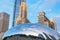 Reflection of city buildings on a metal surface of Cloud Gate also known as the Bean, Millennium Park