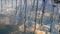 Reflection of clouds and boat mast in the Mediterranean Sea