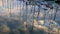 Reflection of clouds and boat mast on the Mediterranean Sea