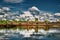 Reflection of the clouds in the lake and the Angkor Wat temple of Cambodia in the background