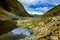 Reflection of clouds and sky serene desert valley in the hills of Himalaya