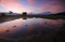 Reflection of colorful sunrise with Mount Kinabalu at the background