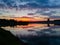 A reflection of a colorful sunset in the river Sava in Bosanski Brod