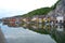 The Reflection of Colorful Traditional Architectures on the Meuse River in Dinant