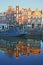 Reflection of crooked and colorful heritage buildings along Prinsengracht Canal and next to Brouwersgracht Canal, Amsterdam