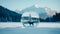 Reflection of a deer in a glass ball with snowy mountains in the background