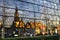 Reflection of Evangelical Reformed Church in modern glass building during sunset. Leipzig, Germany. November 2019