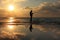 Reflection of a fisherman at dawn