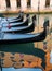 Reflection of the gondolas in the water in Venice