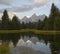 Reflection of Grand Teton and the Teton range in pond