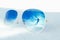 Reflection of happy jumping woman in a winter landscape with split effect. Sunglasses in snow. Freedom and joy of life concept
