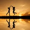 Reflection of Happy of two women jumping and sunset silhouette