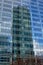 Reflection of highrise tower in the windows of another tower at La Defense busines district, paris, france