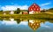 Reflection of house and barn in a small pond, in rural York County, Pennsylvania.