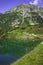 Reflection of Hvoynati peak in Okoto lake, Pirin Mountain