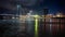 Reflection of the illuminated bridge in the river at night