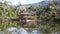 Reflection of A Kiosk In A Beautiful Lake With Mountains In The Back - Pan - Right To Left