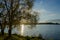 Reflection of light in the water from the rays of the setting sun. Great place for outdoor recreation with a tent.