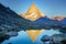 Reflection of the Matterhorn on blue lake at sunrise, Swiss Alps, Zermatt