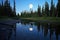 reflection of the moon in a serene water body