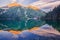 Reflection in Morskie Oko tarn during  sunrise in Polish High Tatras during autumn