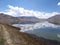 Reflection of Muztagh Ata in the blue waters of Karakul Lake, Xinjiang Uyghur Autonomous Region, China