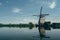 Reflection of one of the Windmills at Kinderdijk, UNESCO heritage museums on a scenic mirror lake