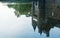 Reflection in the pond of the turrets of the 14th century Chateau de Trecesson