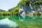 Reflection of a rock wall in a lake of Plitvice Lakes National Park.