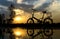 Reflection of Silhouette bicycle park on the waterfront