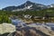 Reflection of Sivrya peak in Banski lakes, Pirin Mountain